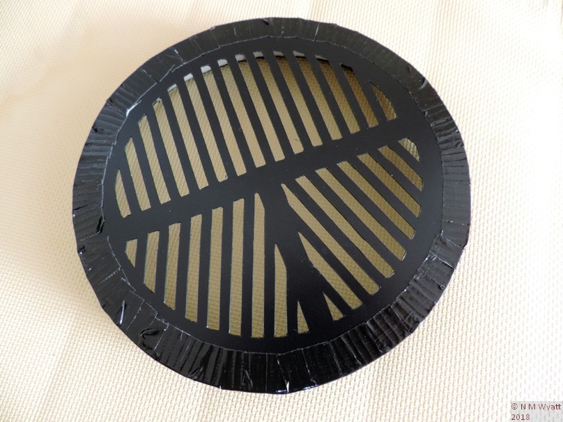 A Bahtinov mask cut from a plastic folder