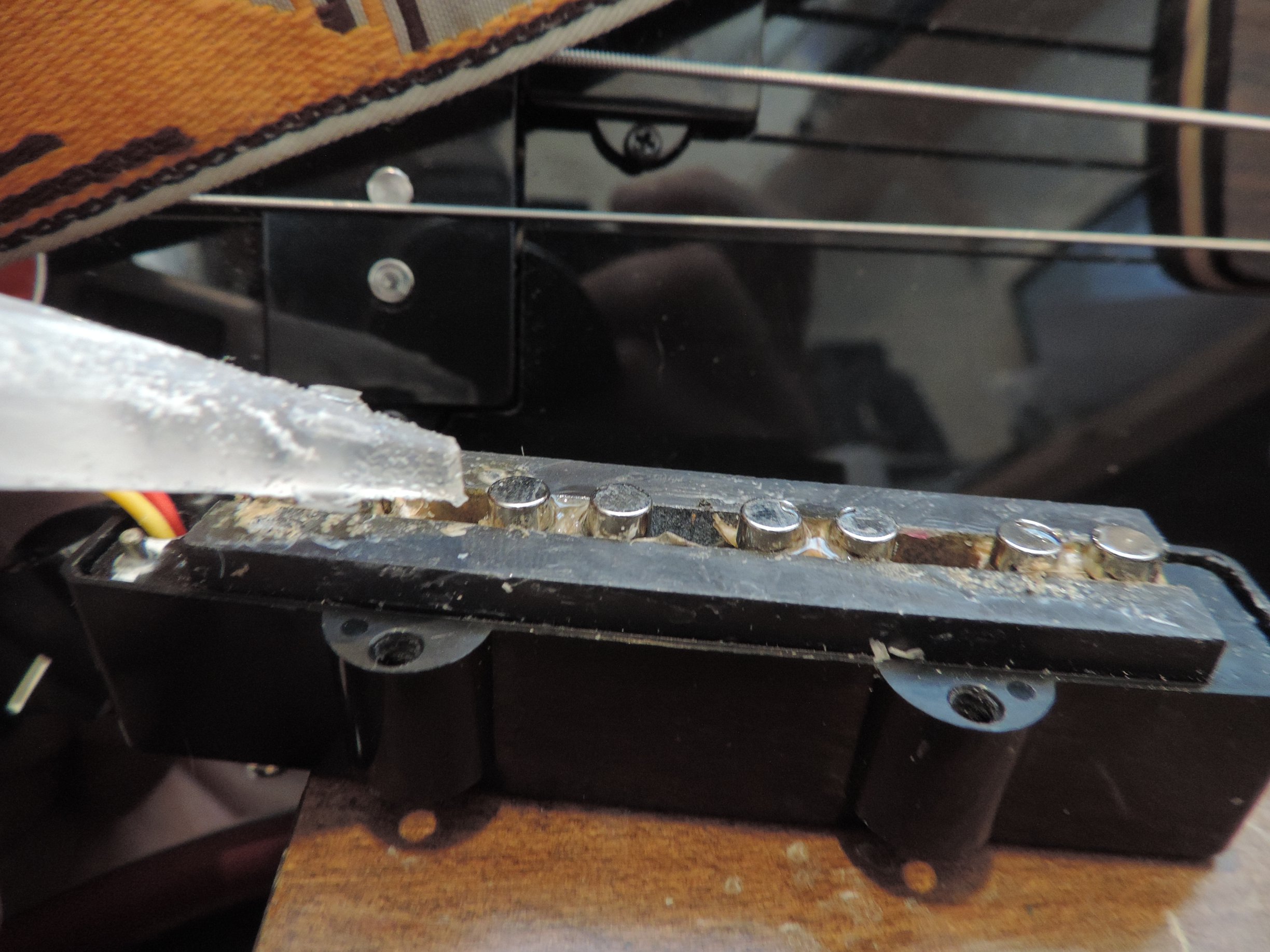 Gluing magnets in place on the pickup
